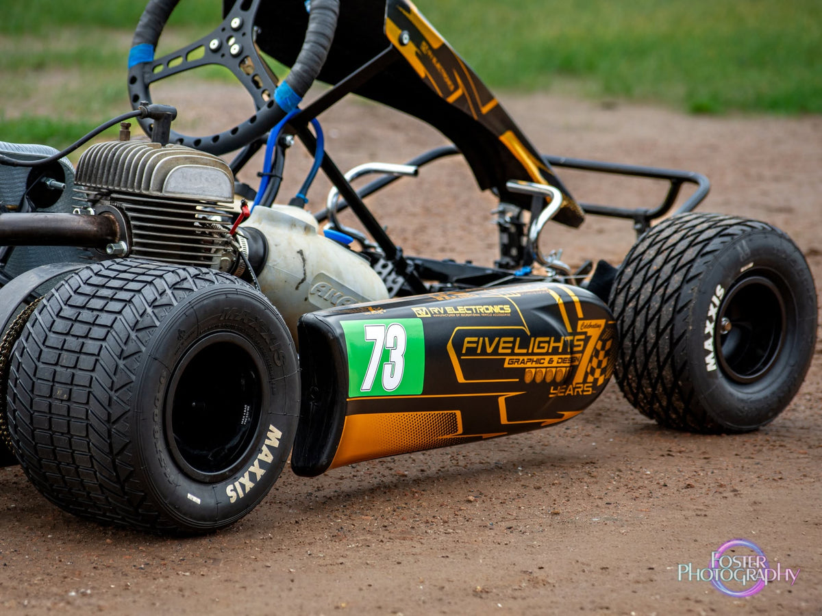 Close-up of a kart engine, side pod and Maxxis tyres