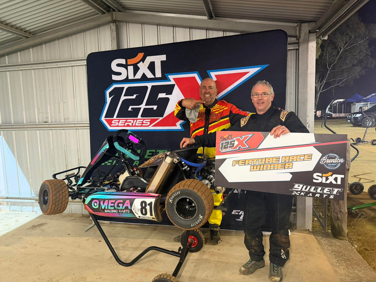 Paul Walsh with Allan and the Omega kart after Allan’s feature-race win.
